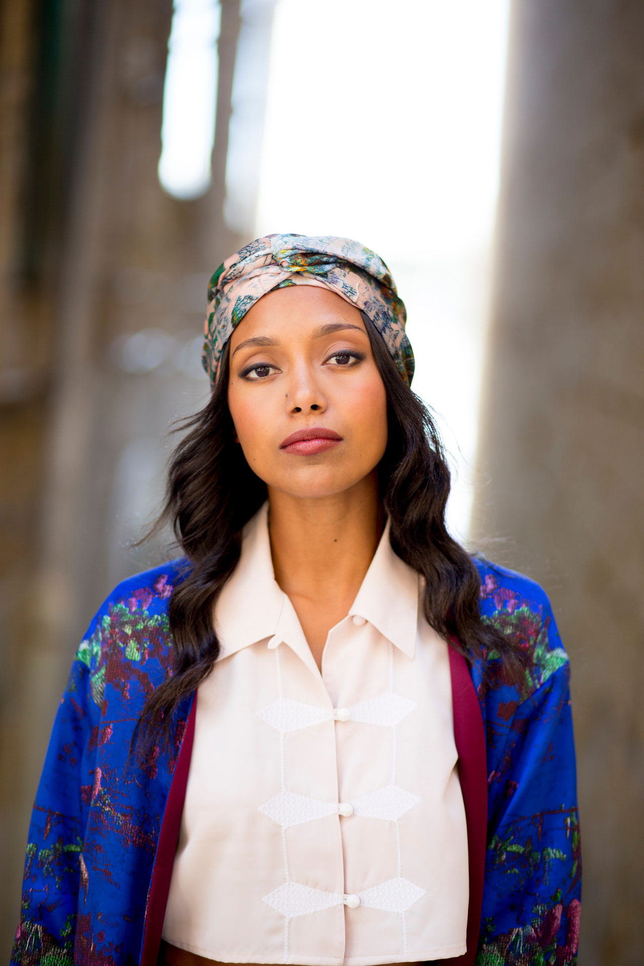 Model in a blue brocade jacket and turban