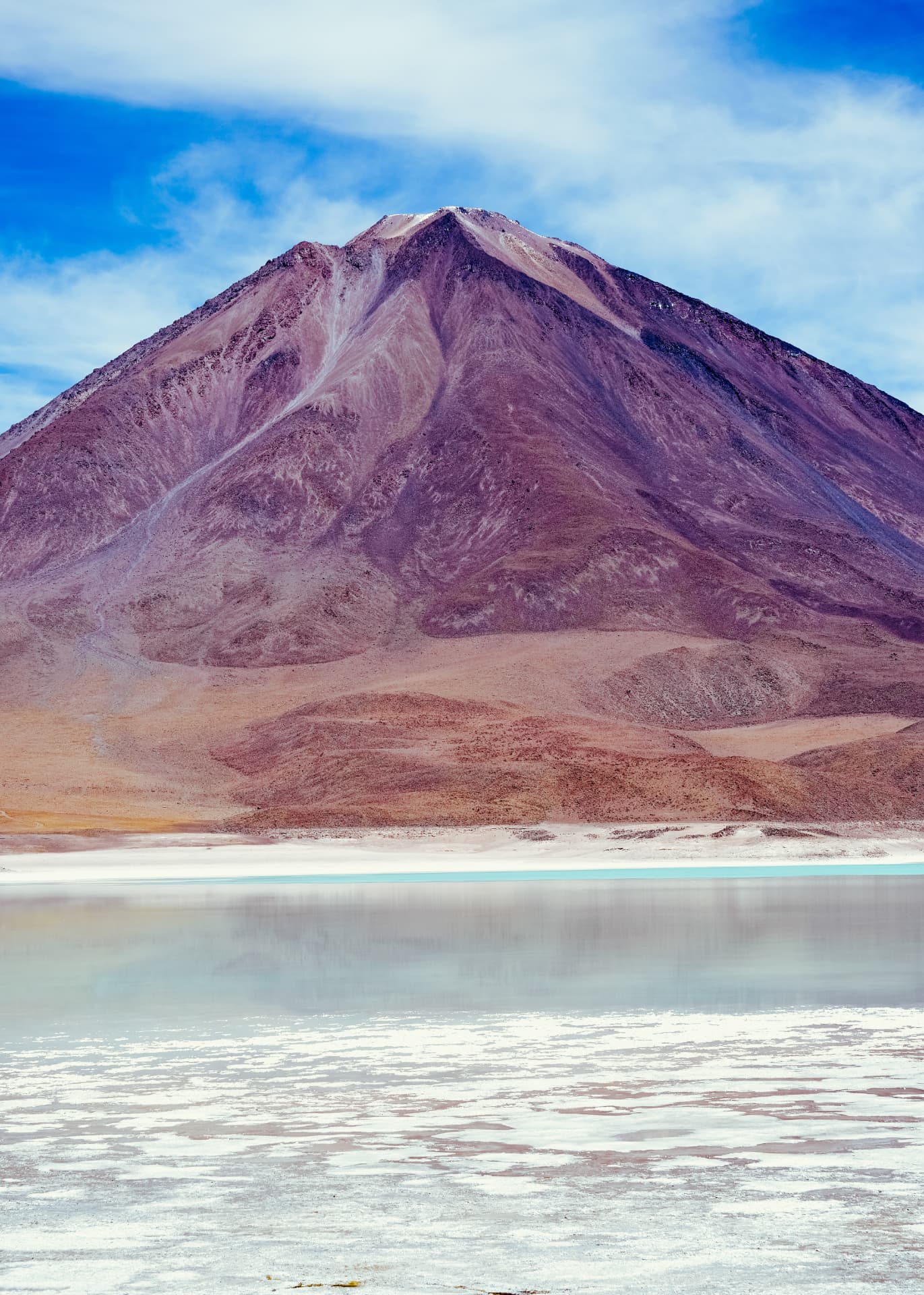 Volcano reflected in the pale waters of Laguna Verde, Bolivia