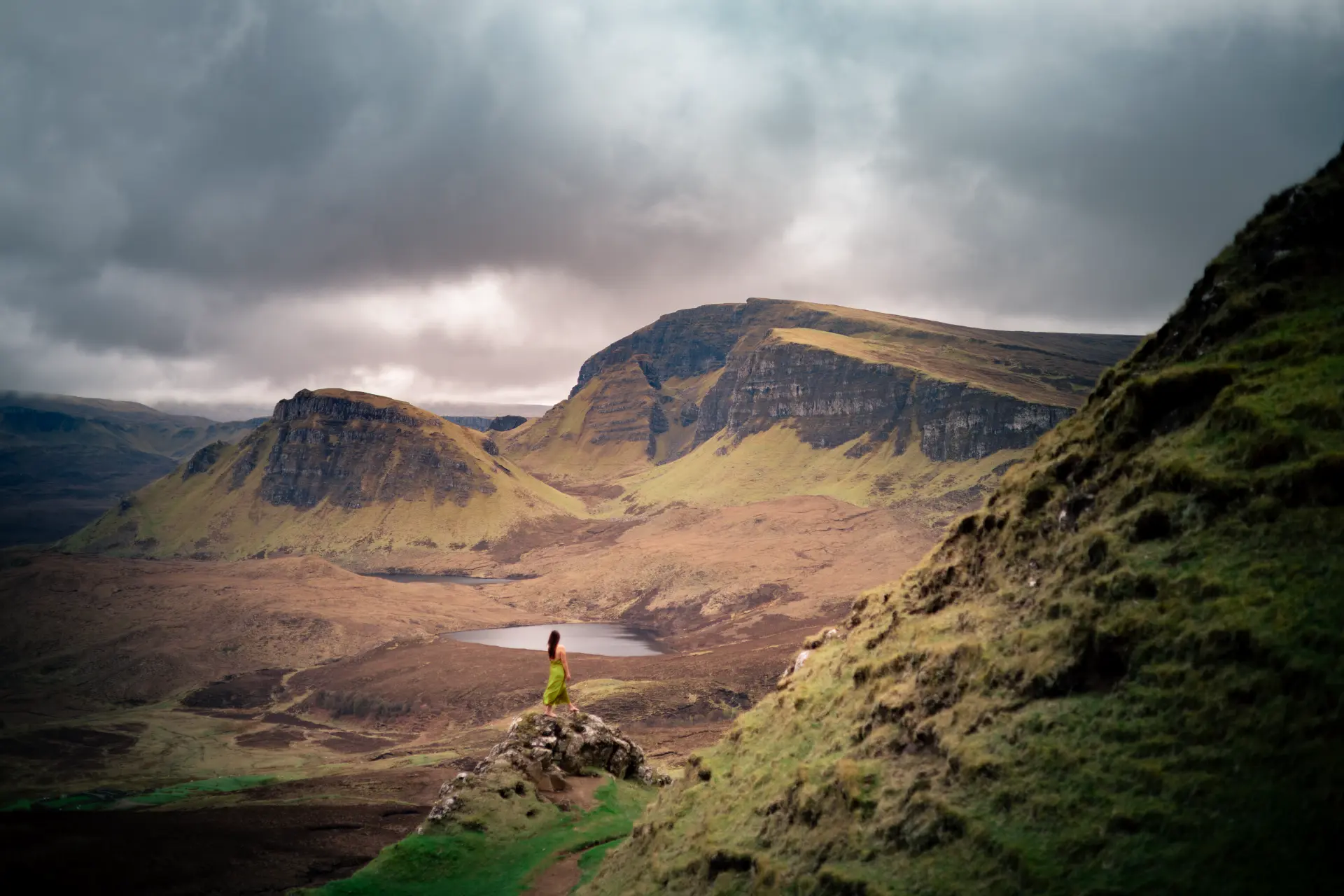 Figure in a green dress on the Quiraing ridge, Isle of Skye
